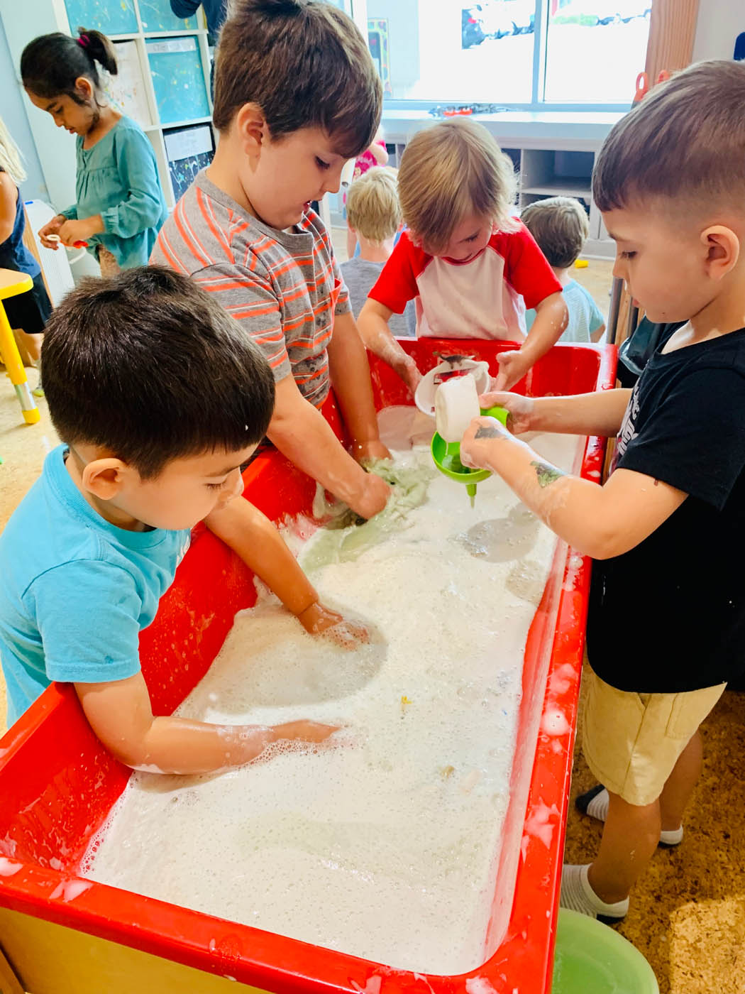 Kids playing in sand at our early childhood education in Mt. Pleasant, SC.