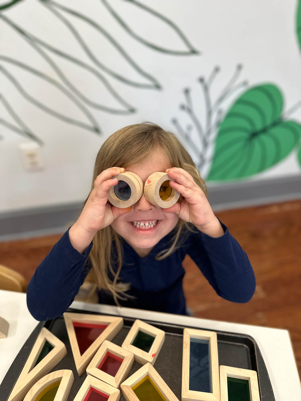 A little girl playing at Kids Garden a montessori school in Charleston, SC.