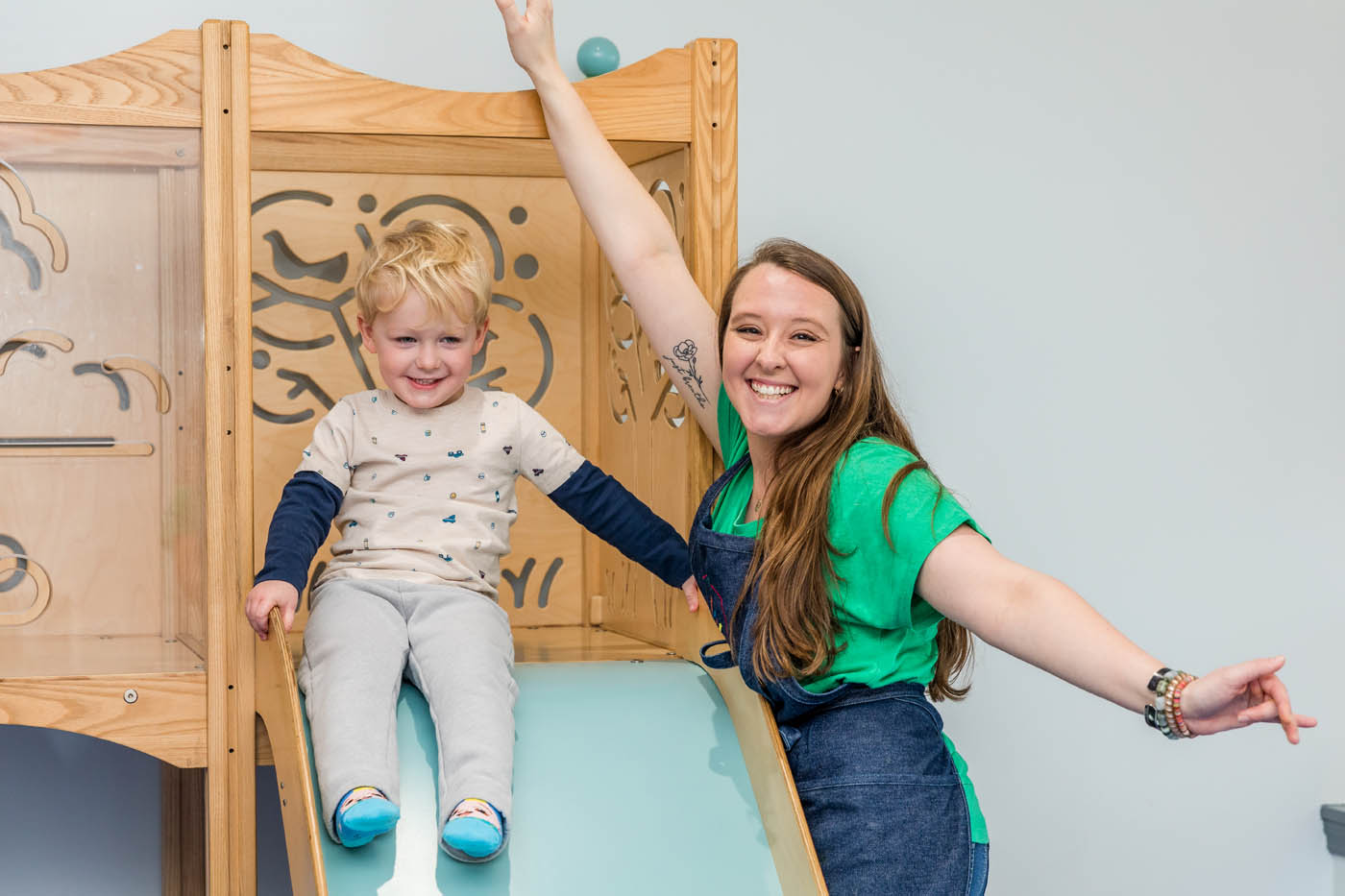 A teacher with a child during a mommy and me group.