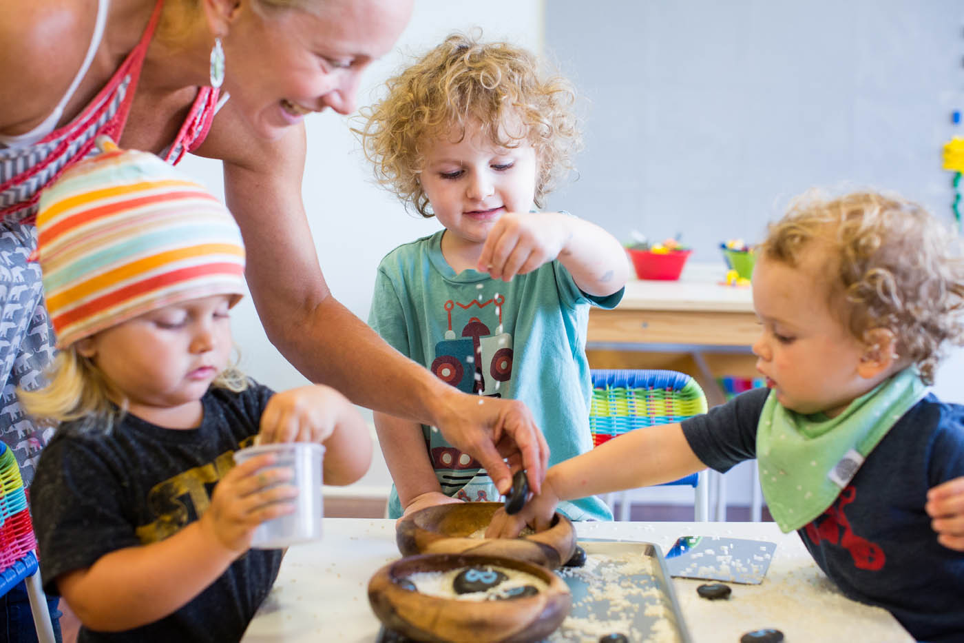 One of our amazing Kids Garden Asheville teachers with a classroom of children - see our mention in CHARLIE's year in review edition!