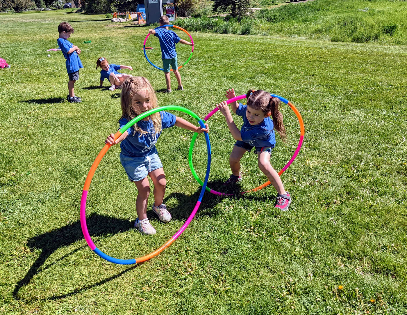 A group of children playing outside - see more summer activity ideas from Kids Garden!