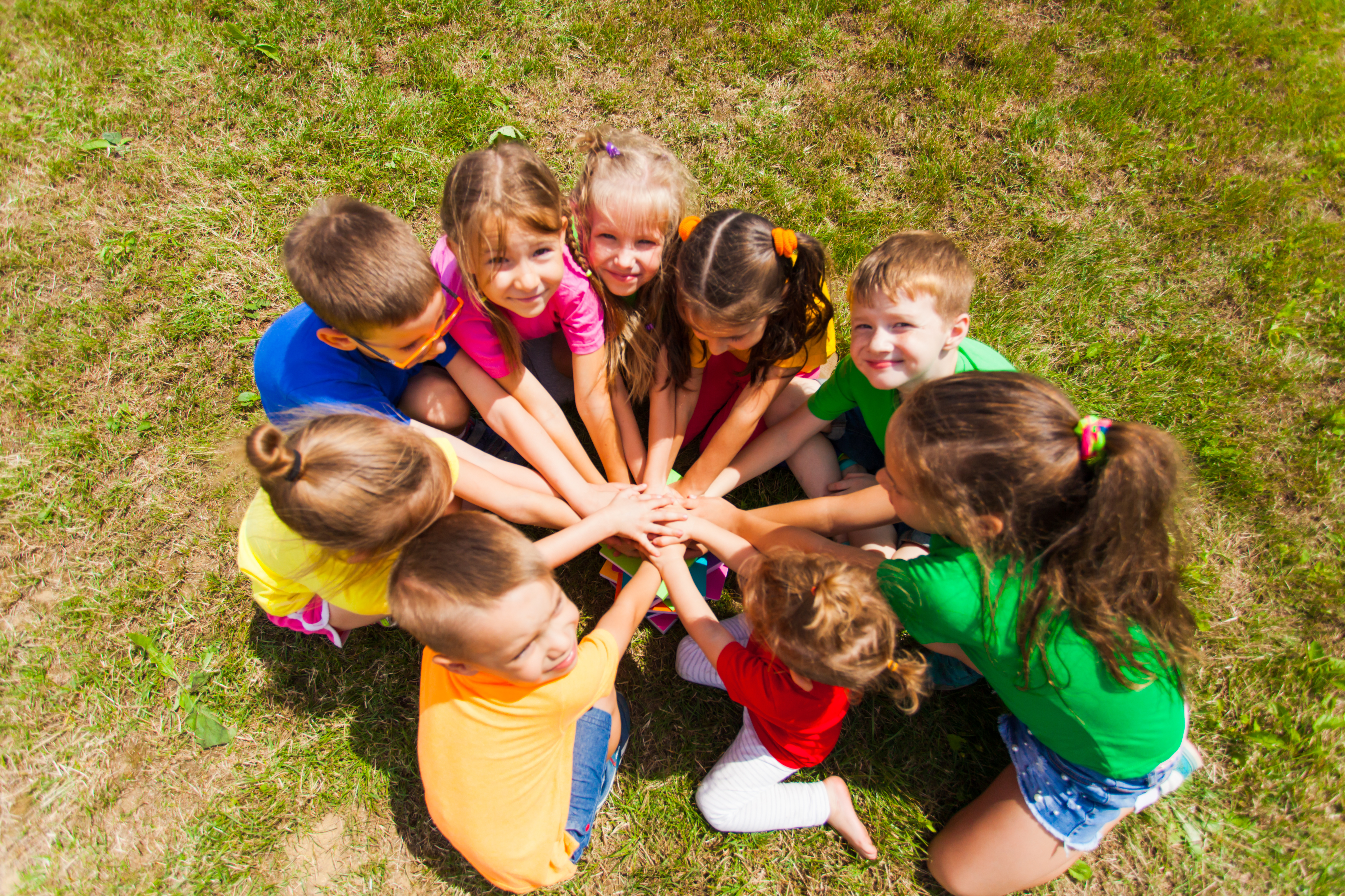 A group of kids having fun at a Kids Garden Asheville summer camp.